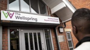 The wellspring front view with man out front
