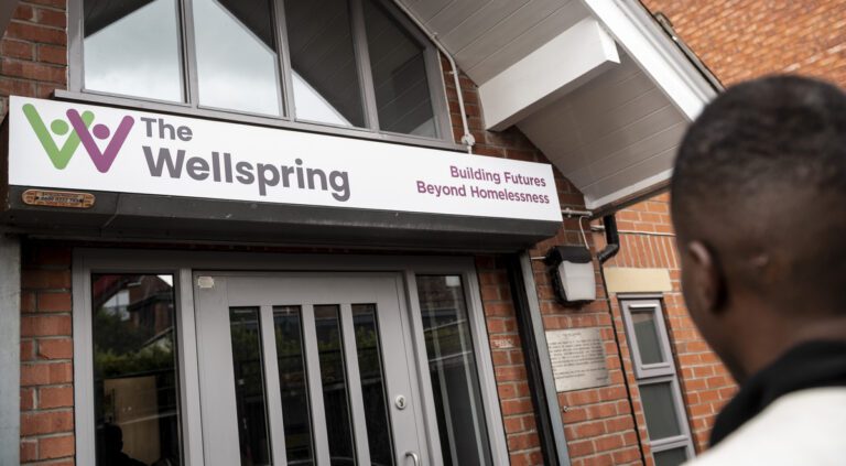 The wellspring front view with man out front