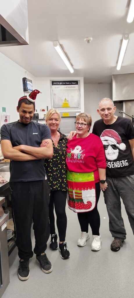 Group in a kitchen with Christmas clothes